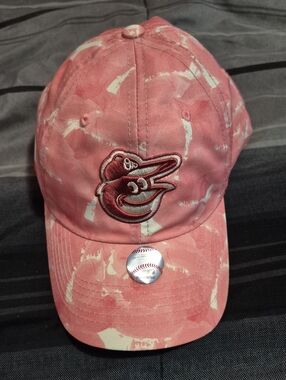 The Baltimore Orioles Genuine Merchandise Fan Favorite Adjustable Hat for women.